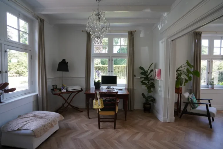 Spacious study with a desk and garden views