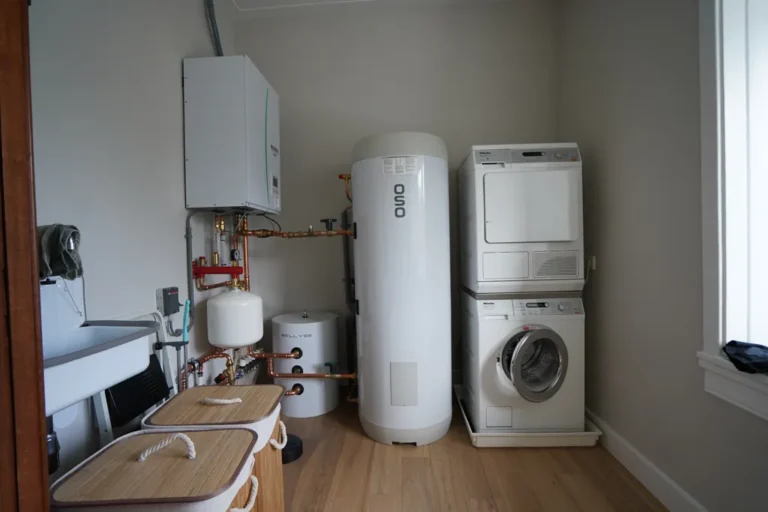 Utility room with wall-hung boiler, hot water cylinder and stacked washer-dryer – Meindert Hobbemastraat, Heemstede
