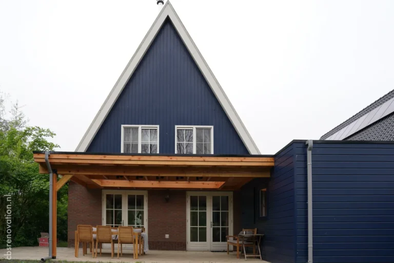 Rear of the renovated house with a covered veranda and outdoor dining area