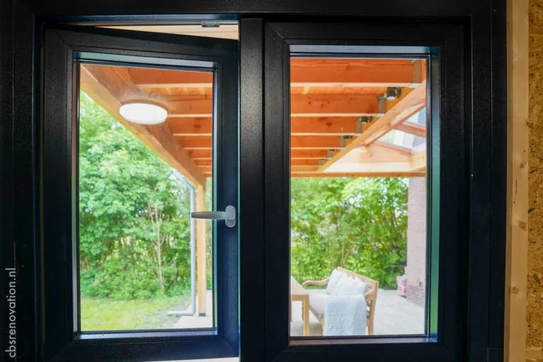 Open window overlooking the covered terrace from the garden room