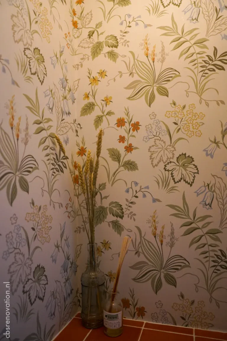 Floral wallpaper and dried flowers in a renovated toilet