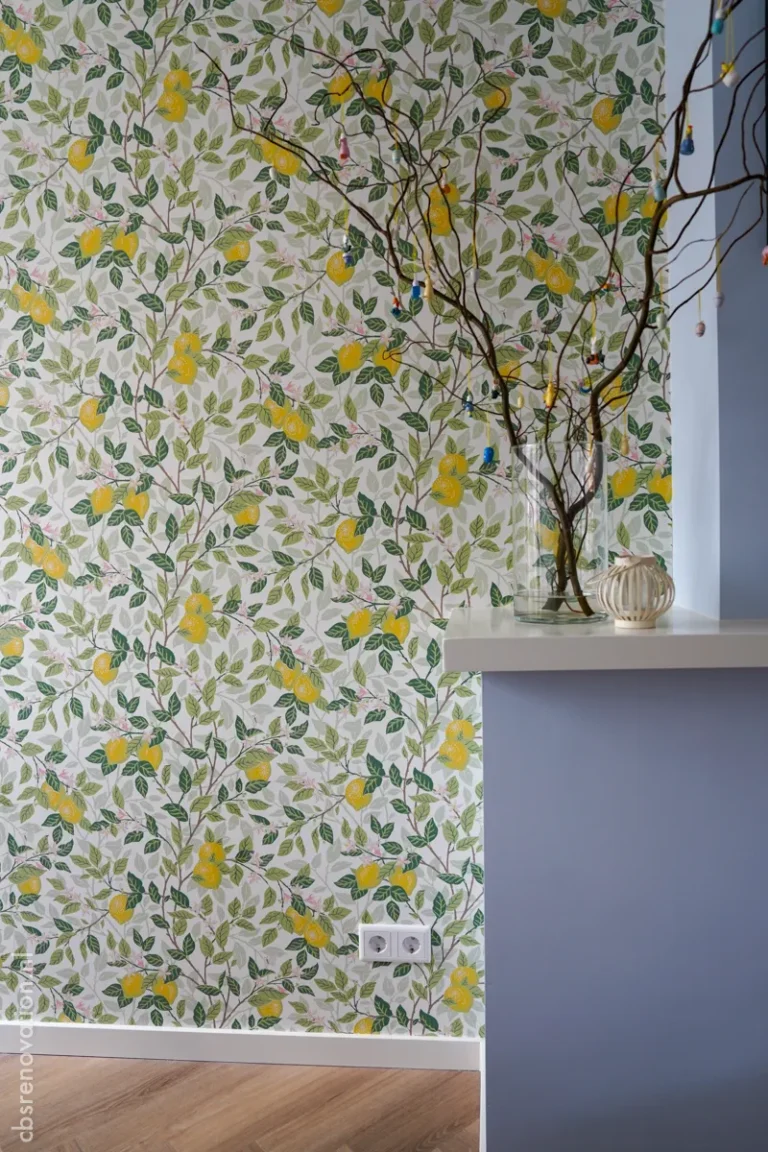 Lemon-print wallpaper accent wall in a renovated room