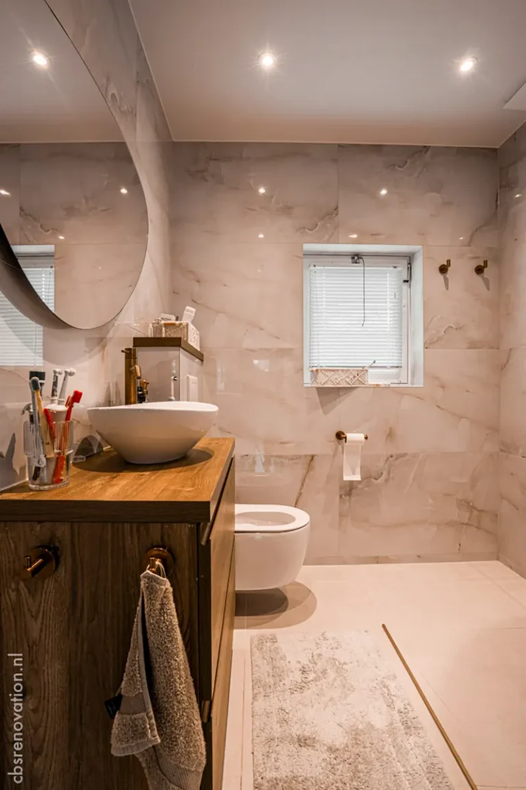 Marble-tiled bathroom with a wooden vanity and vessel sink