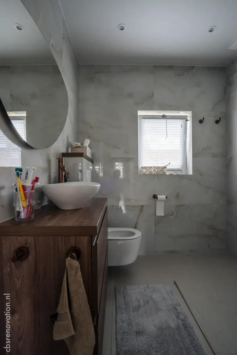 Bathroom with microcement walls, a wooden vanity and walk-in shower