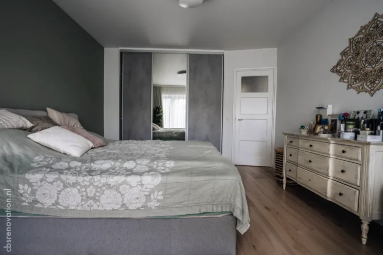 Bedroom with fitted wardrobes and a chest of drawers