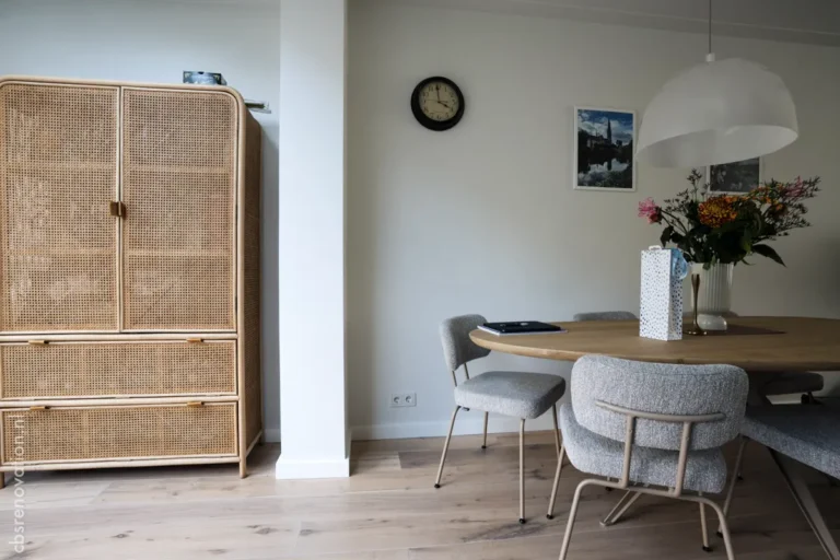 Dining area with a cane cabinet and a wooden table