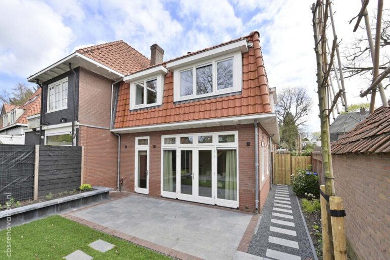 Rear facade after renovation with new roof tiles, a dormer and folding garden doors