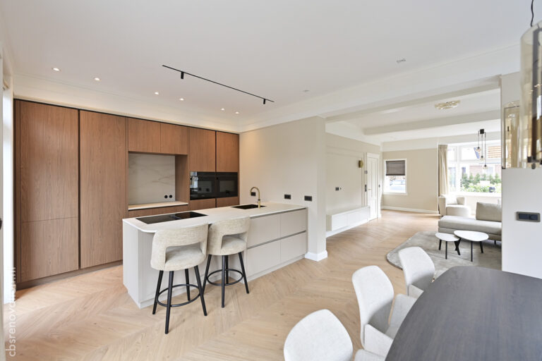 Kitchen island with bar stools, open to the living room