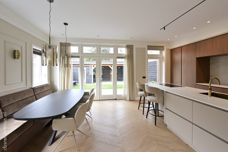 Dining area and kitchen island seen from the banquette