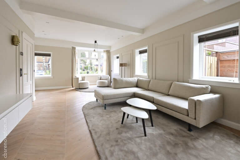 Living room with a corner sofa and panelled walls