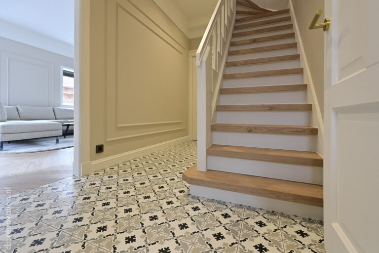 Hall with patterned cement floor tiles and the renovated staircase
